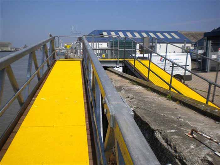 Yellow walkway cover on a wooden boardwalk